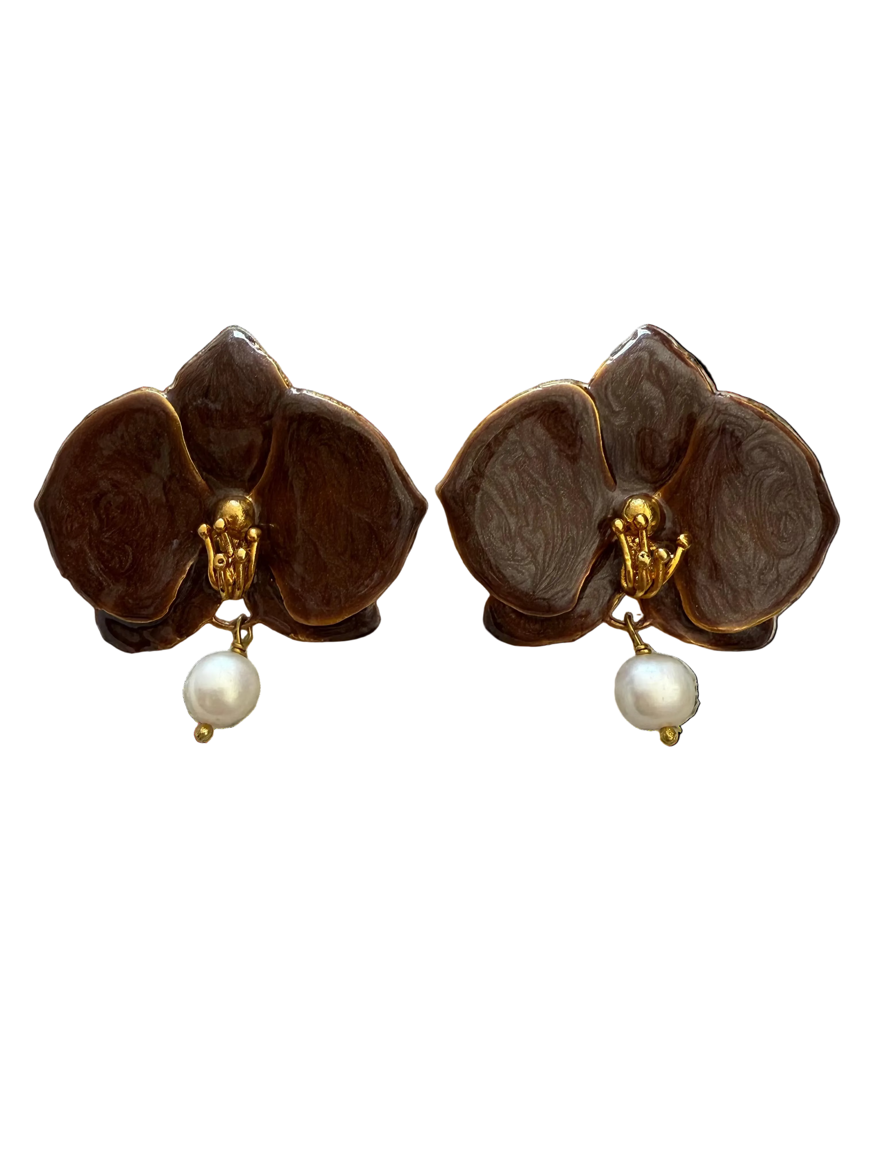 Pair of brown flower-shaped earrings with pearl drops on a textured beige fabric background